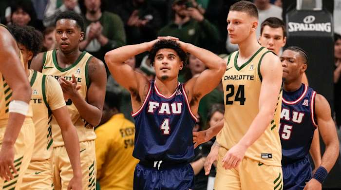 Florida Atlantic guard Bryan Greenlee, center, reacts to his foul that takes Charlotte to the line for the winning free throws.